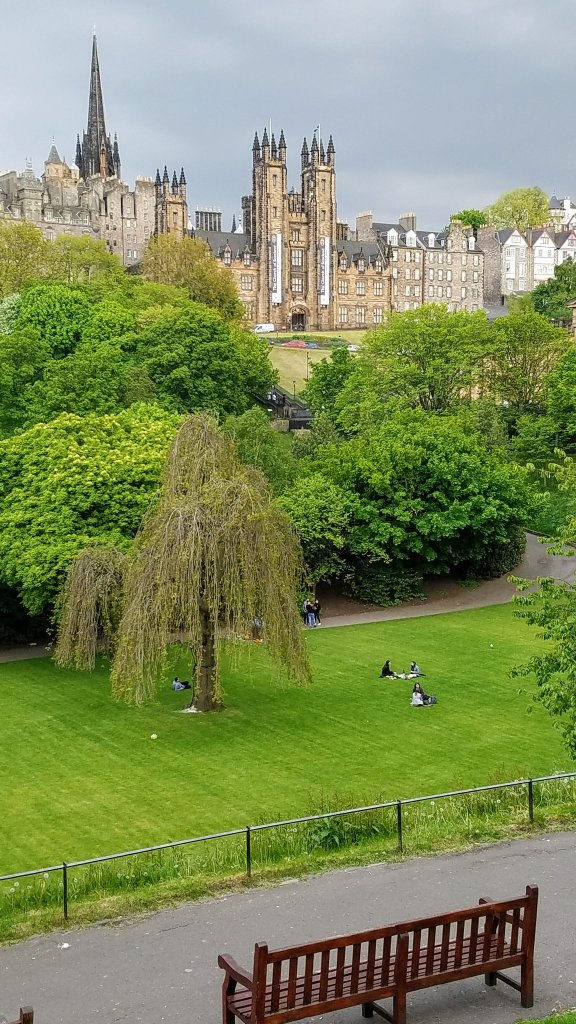 View of a park and some beautiful historical buildings in Edinburgh, Scotland.